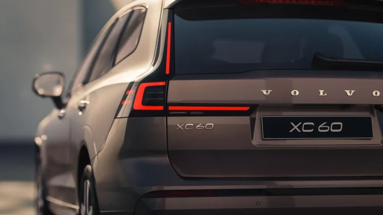 Image 11: Volvo XC60 rear view showcasing sleek design and distinctive taillights.
