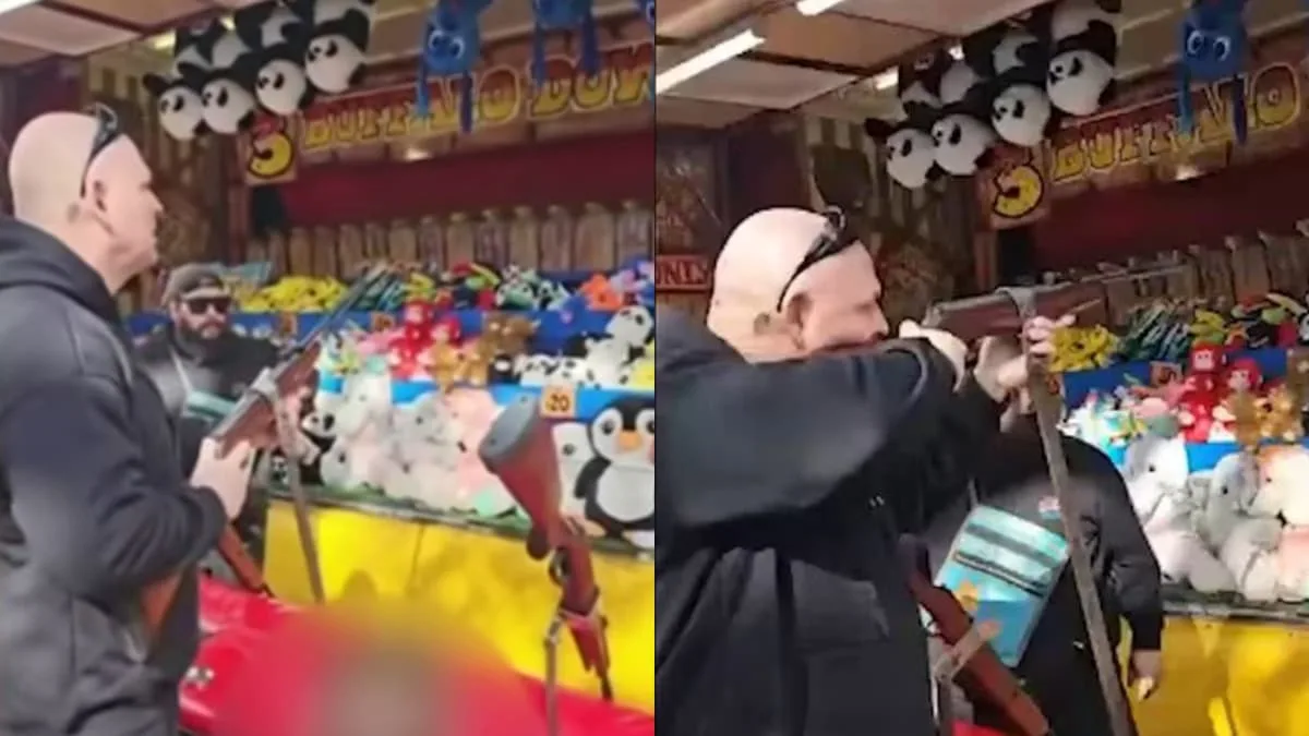 biker shooting ducks at carnival