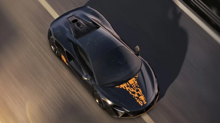 top view, sports coupe driving on track with graphic hood decal and motion blur. 2027 McLaren Artura 1000GP
