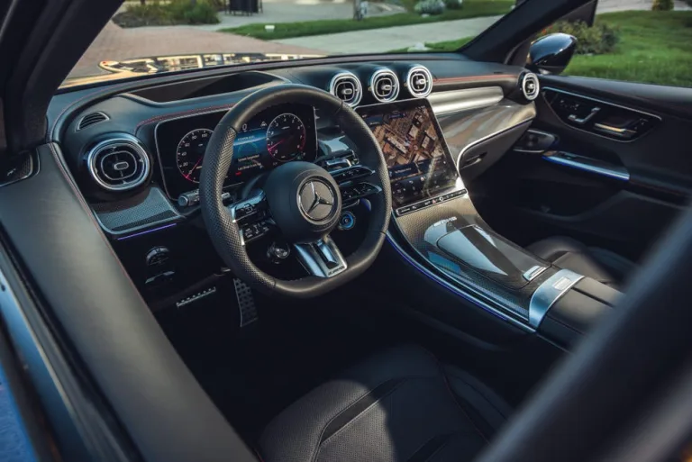 Interior view of a modern luxury car dashboard with advanced display and controls. Interior view of a modern luxury car dashboard with advanced display and controls.