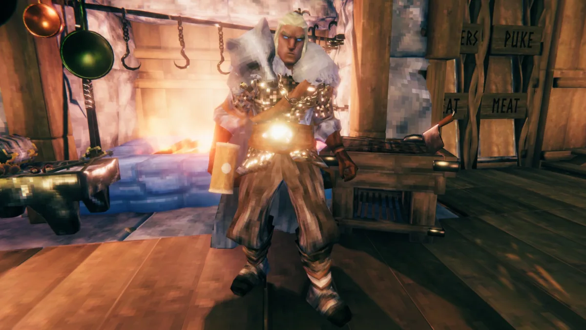 Image 28: Valheim -An adventurer wearing ashining gold armor and a wolf pelt