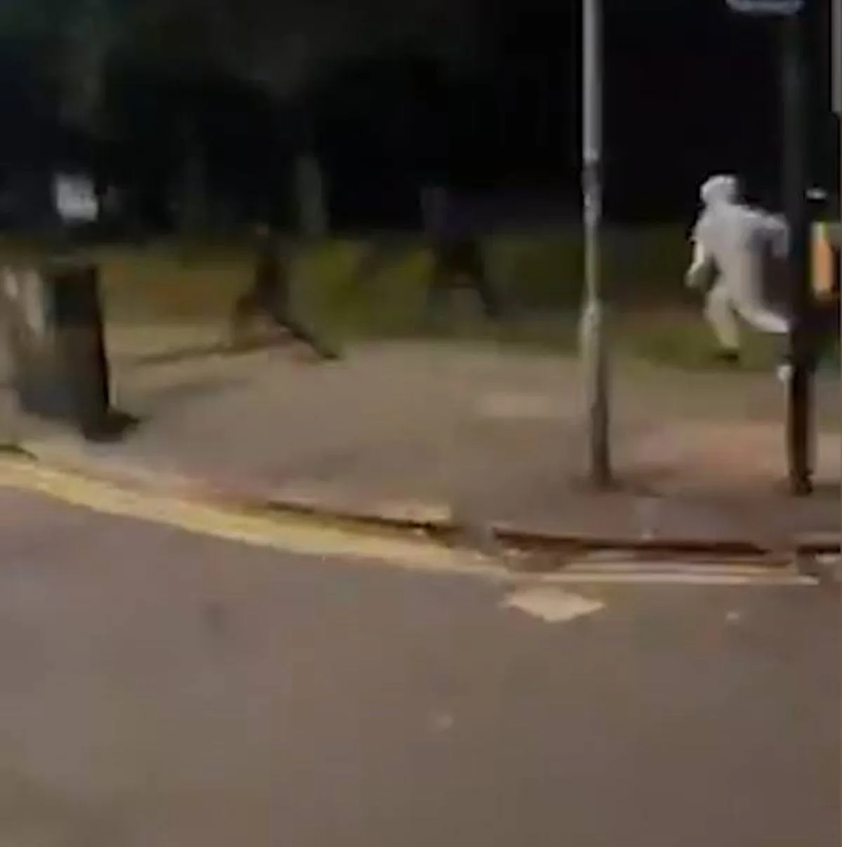 Image 8: The gang chased the man through the streets.
