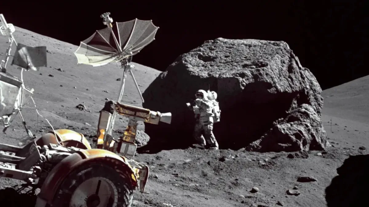Image 42: A photo of a NASA astronaut collecting regolith samples on the moon