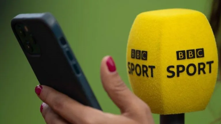 Image 3: BBC Sport microphone and phone