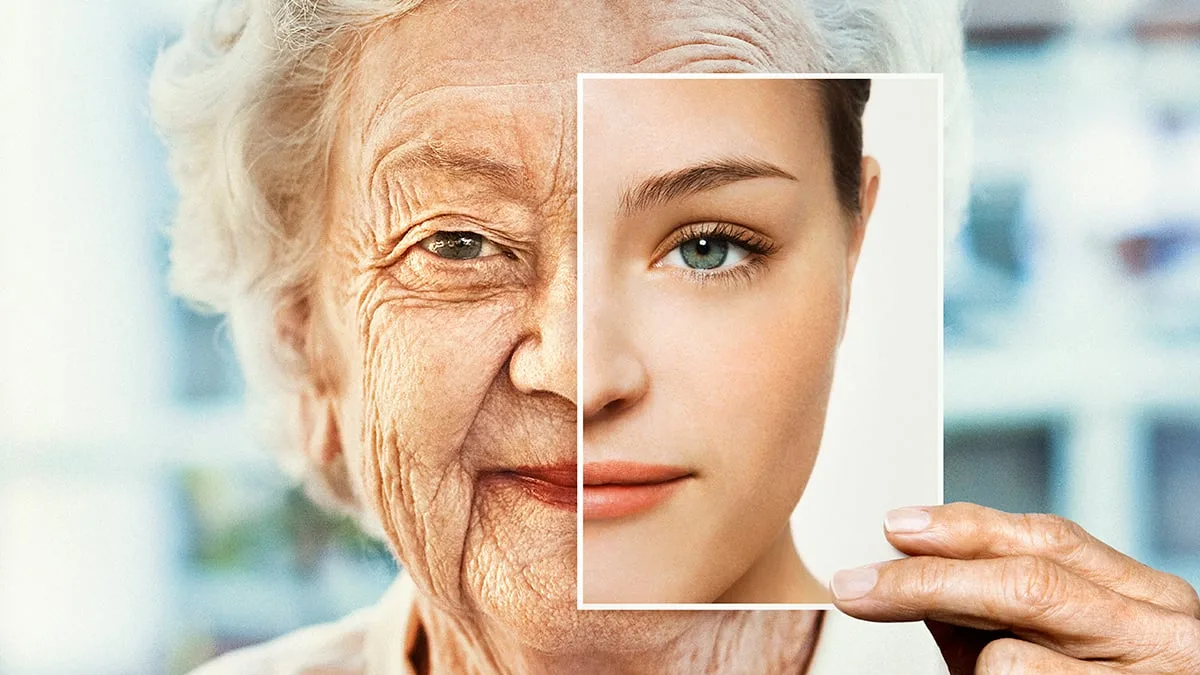 Portrait of woman holding younger photo of herself The results are intriguing, but they come with important limitations. (Dimitri Otis/Stone/Getty Images)