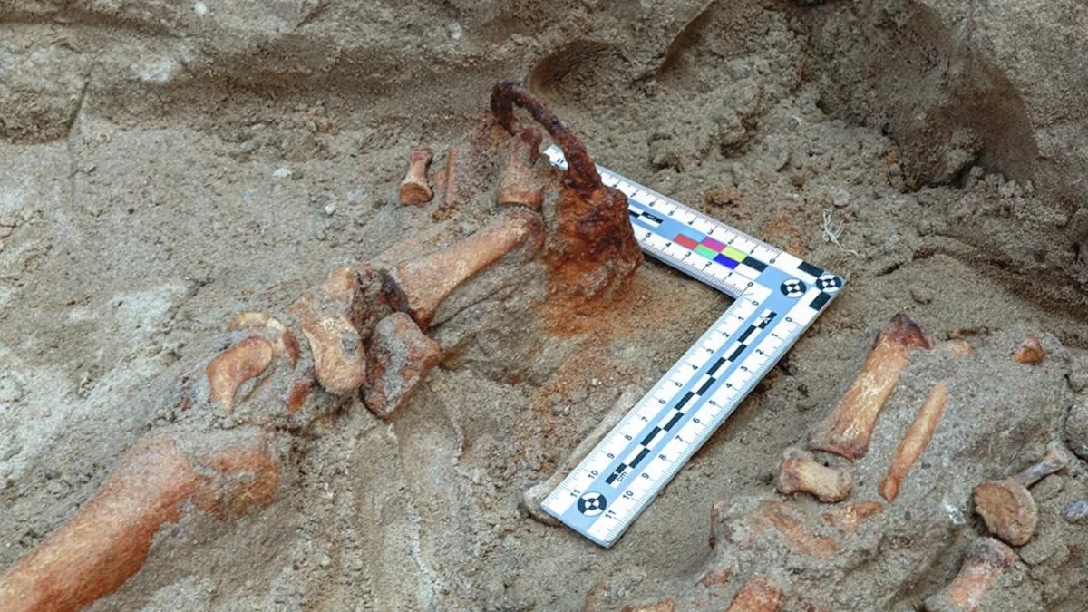 Anti-Demonic Evidence Reveals 17th-Century Villagers Were Terrified of What Lurked in 'Grave 75' The padlock around the toe of the skeleton. (Poliński et al., J. Archaeol. Sci. Rep