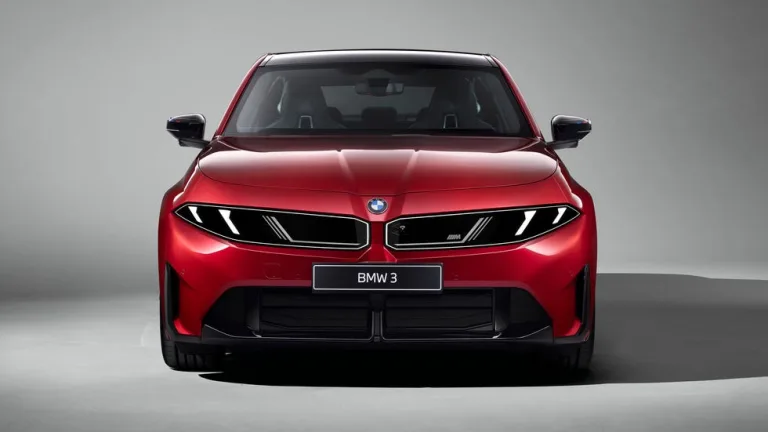 Front view of a sleek red BMW 3 against a minimalist grey background. Front view of a sleek red BMW 3 against a minimalist grey background.